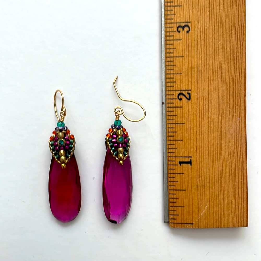 Miguel Ases deep pink drop earrings.